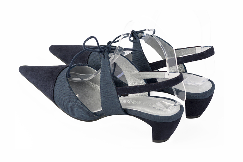 Navy blue women's open back shoes, with an instep strap. Pointed toe. Low comma heels. Rear view - Florence KOOIJMAN